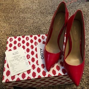 Red patent leather pumps